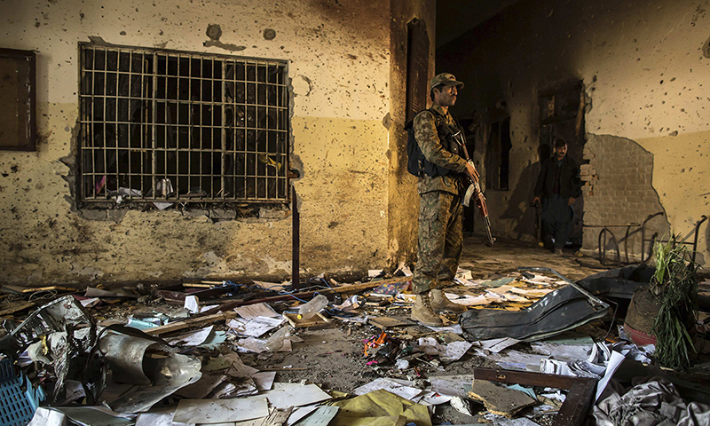 An army soldier stands inside the Army Public School, which was attacked by Taliban gunmen, in Peshawar An army soldier stands inside the Army Public School, which was attacked by Taliban gunmen, in Peshawar